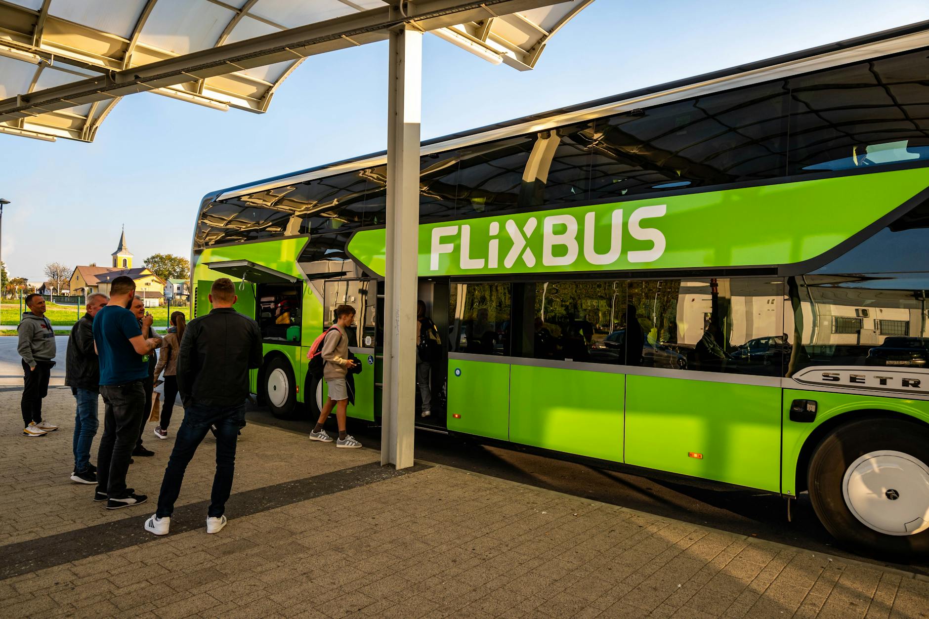 travelers boarding flixbus at kutina station