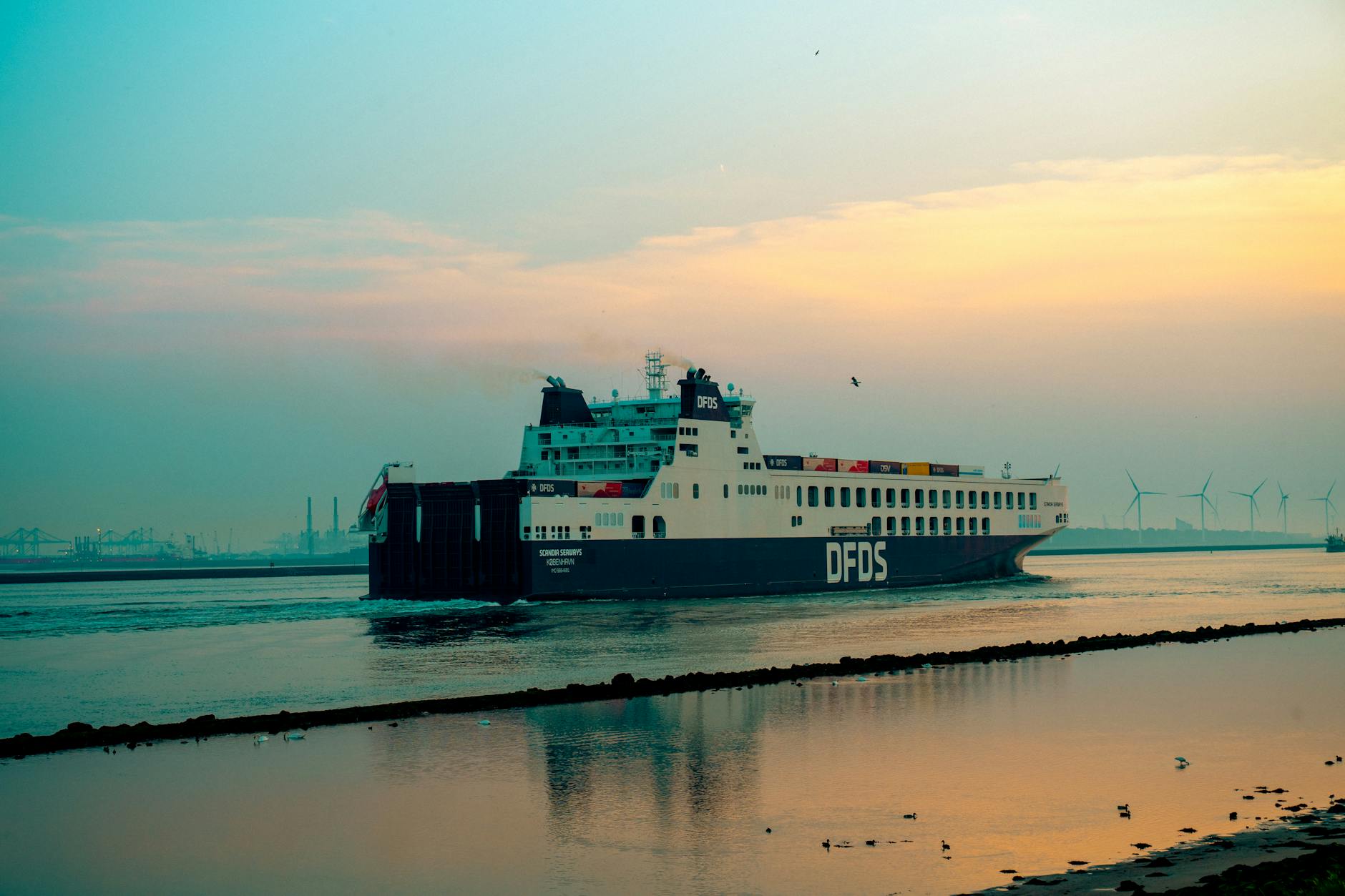 ferry at sunset in hoek van holland harbor